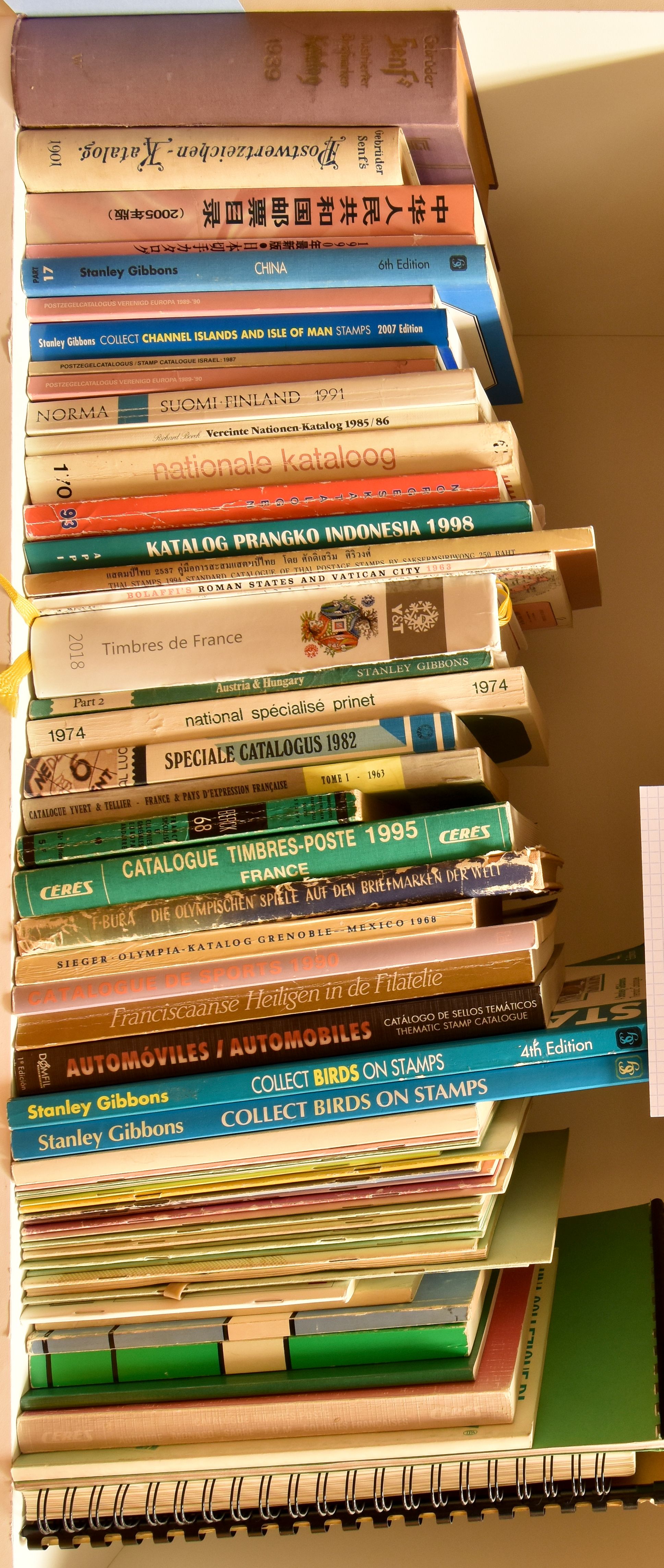 Catalogues from various countries, accumulation of 64 books, see photo on website