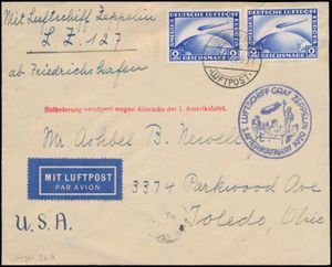 15.5.1929 N° 23a (Mi. Zeppelin Specialised), LZ 127 Amerikafahrt brief verzonden naar Toledo, Ohio en gefrankeerd met twee losse postzegels van 2 RM (Michel 423) met een stempel van Friedrichshafen, zeppelinvluchtstempel in blauw ernaast en een enkele regel handstempel in rood aangebracht toen het luchtschip een noodlanding moest maken in Cuers (waardoor de bezorging vertraging opliep), aankomststempel op de achterkant, vage vouw op de rechterzegel, verder in zeer goede staat, zm