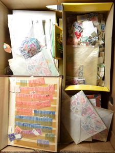 Banana box filled with paper-free, to be checked. stamps, mostly sorted by stamp