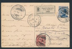 1911 Italiaanse postkantoren in Libië, N° 82 + 83 (Sass.) ansichtkaart (met afbeelding van Kirkarish) aangetekend verzonden vanuit Tripoli di Barberia naar Frankrijk en gefrankeerd met Italiaanse 10c karmijnrode en 25c blauwe definitieve postzegels, beide voorzien van 