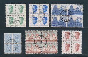 Stock of stamps in 2 albums, blocks of four with central cancel, long-running sets together with a few others, many from Limburg, vf/f