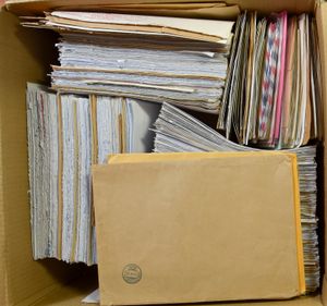 2 shoe boxes and 1 flat box with thousands of flag stamps, to be checked