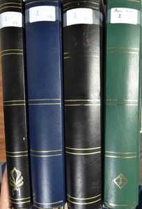 Stockbooks, 4 thick stockbooks with black sheets